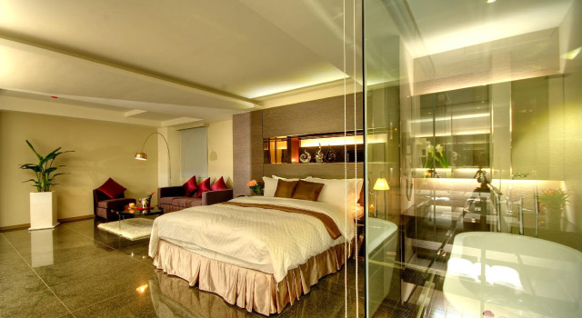 Кровать в общем номере Kapok Hotel & Resorts