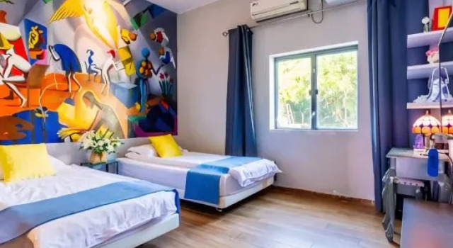 Кровать в общем номере с 6 комнатами Laodao Library Hostel