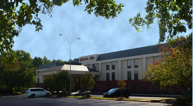 Кровать в общем номере Hampton Inn Sanford