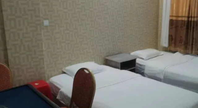 Четырёхместный люкс Tangwanghe Weishi Business Hotel