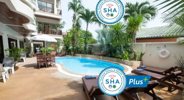 Кровать в общем номере Palmview Resort