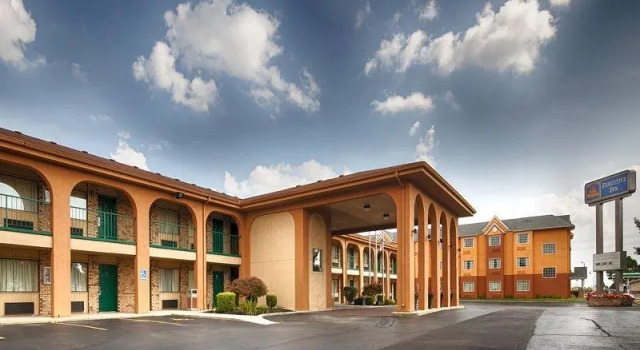 Кровать в общем номере Best Western Executive Inn