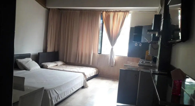Кровать в общем номере Apartasuites Casa Veraneras De Colinas