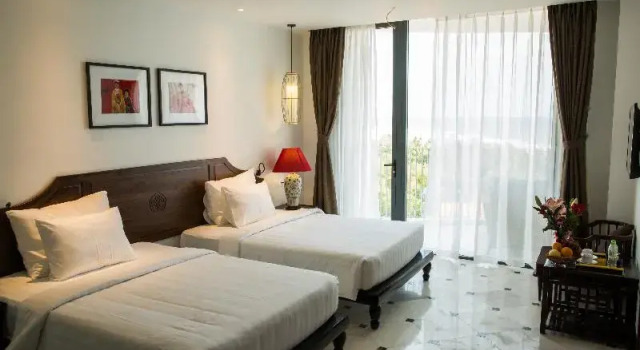 Двухместный номер Deluxe с балконом и с видом на сад The Palmy Phu Quoc Resort & Spa