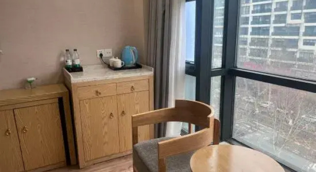 Кровать в общем номере Xinyue Hotel