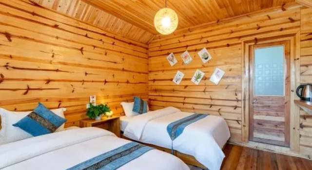 Кровать в общем номере с 3 комнатами Qiuniang House Lugu Lake