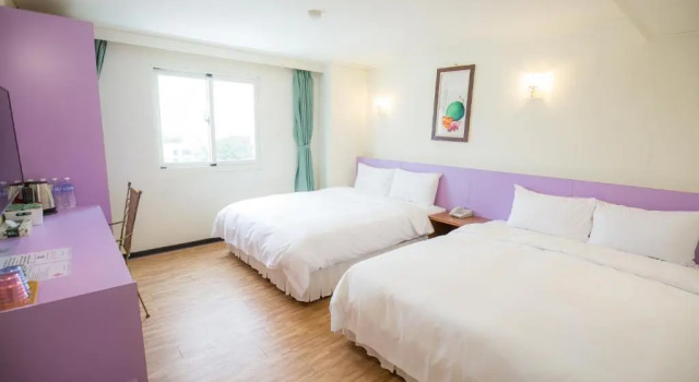 Komfortowy czteroosobowy pokój Apple Hotel