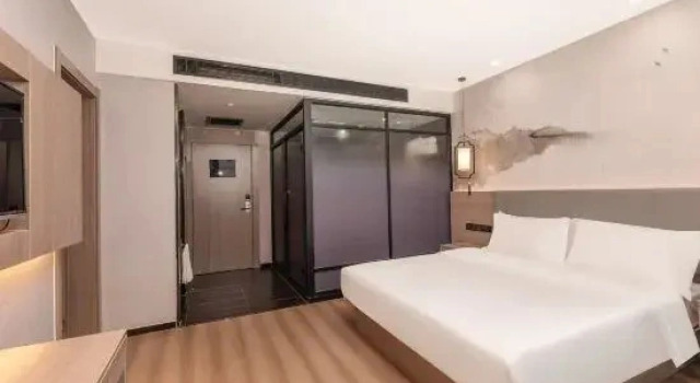 Люкс Huaju Hotel (Wenfeng World Store, Middle Jianghai Road, Qidong)