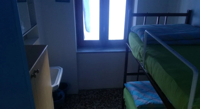 Кровать в общем номере Rifugio La Capanna