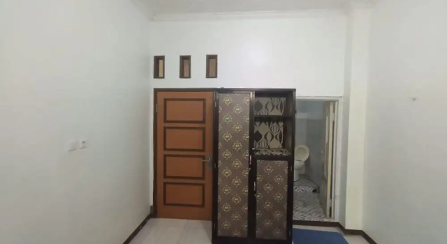 Номер Economy Hotel O Penginapan Hj Lilis 2 Syariah
