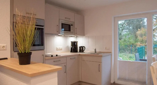 Коттедж WG 8 - Modern ausgestattetes Ferienhaus mit Garten für 2 Personen