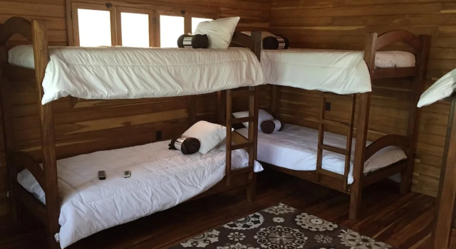 Кровать в общем номере Casa Aura Beachfront B&B