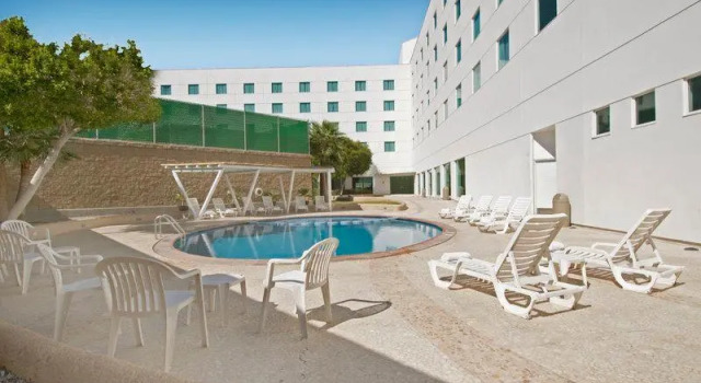 Кровать в общем номере Fiesta Inn Mexicali