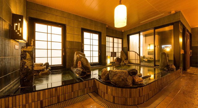 Кровать в общем номере Dormy Inn Express Mikawa Anjo Natural Hot Spring