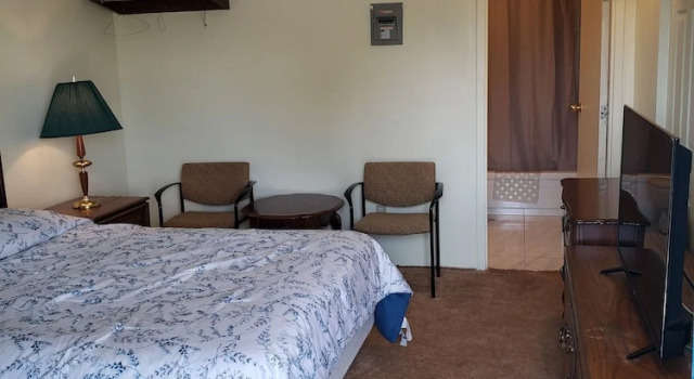 Четырёхместный номер Classic с балконом Olympia Motel