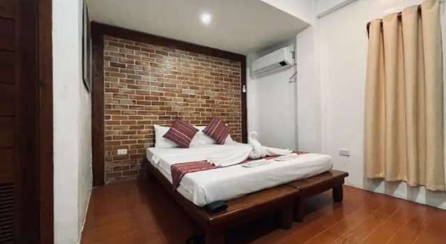 Кровать в общем номере Casa Lorenzo powered by Cocotel