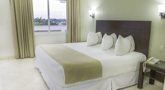 Четырёхместный номер Deluxe с видом на сад Hotel Casa Blanca