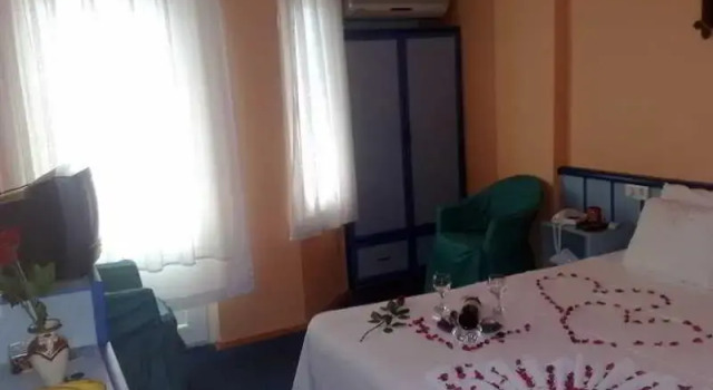 Кровать в общем номере Pamukkale Hotel