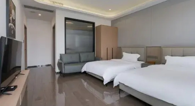 Кровать в общем номере с 4 комнатами Taishan Yihe Wangyuequan Villa