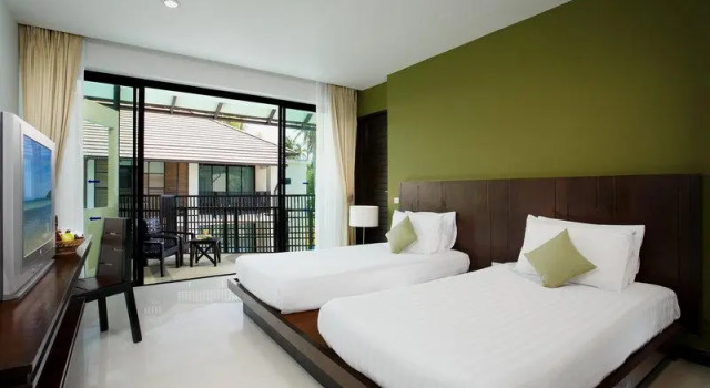 Кровать в общем номере Nivata Koh Samui, Tapestry Collection by Hilton