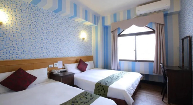 Кровать в общем номере Chiayi Crown Hotel