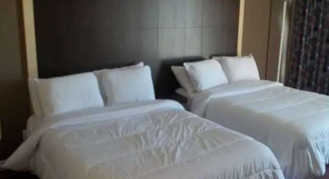 Кровать в общем номере Travelodge by Wyndham Kapuskasing