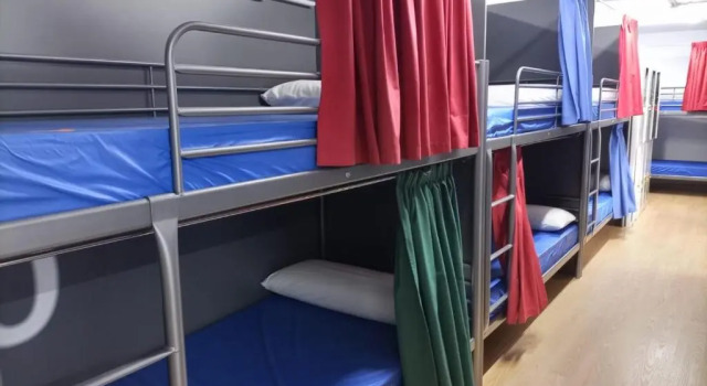 Кровать в общем номере Albergue Avoa Regina