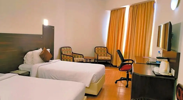 Номер Deluxe Presidency Kochi City Centre