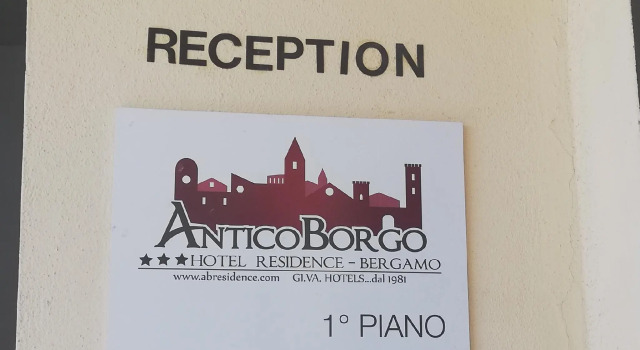 Кровать в общем номере Antico Borgo