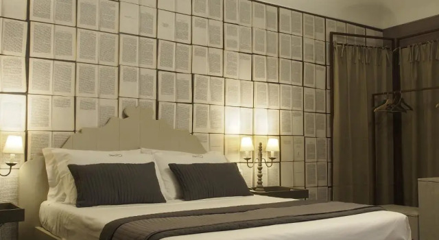 Кровать в общем номере Terrazzani Suite