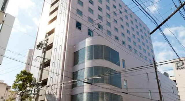 Кровать в общем номере Hotel Resol Gifu
