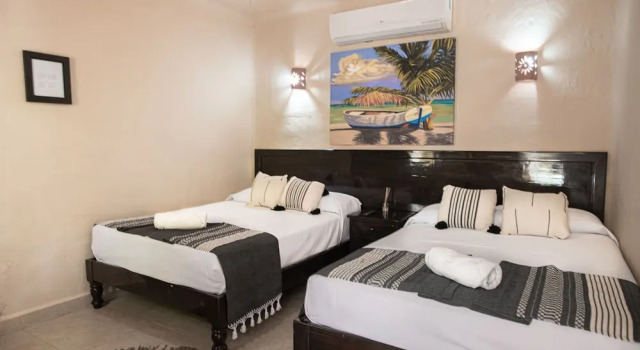 Camera Economy Hotel Macondo Holbox