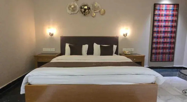 Кровать в общем номере Hotel Supreme Suites Ludhiana