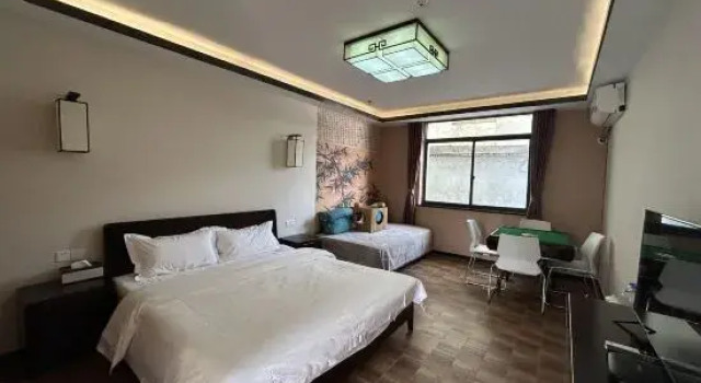 Кровать в общем номере Yunlu Music Homestay (Zhujiajiao Scenic Area)