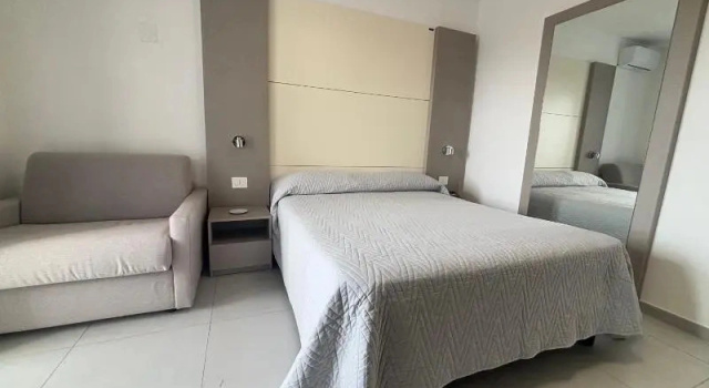 Четырёхместный номер Deluxe с балконом Hotel La Mela