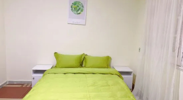 Кровать в общем номере Lemon Tree & Home 2