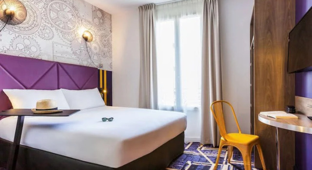 Кровать в общем номере ibis Styles Париж Мэри де Клиши