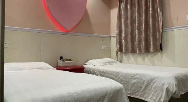 (camerata femminile) letto in camerata Shanghai 520 Theme Hotel (Anting Subway Station)