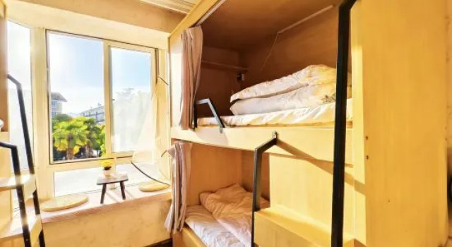 Кровать в общем номере (женский номер) Xiaodou Space Capsule Youth Hostel (Kunming Dianchi Haitang Dam Branch)