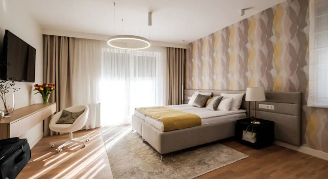 Grand cameră Adele Apartments