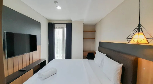 Апартаменты Elegant and Spacious 1BR at Patraland Amarta Apartment By Travelio