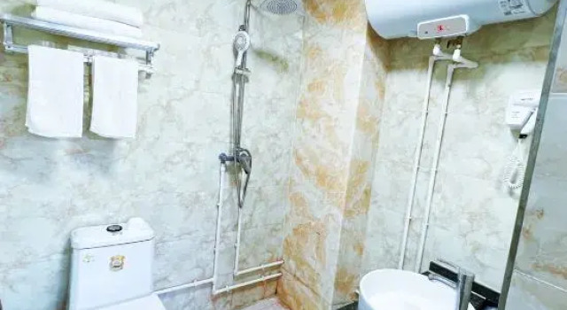 Кровать в общем номере Xinyuan Hotel