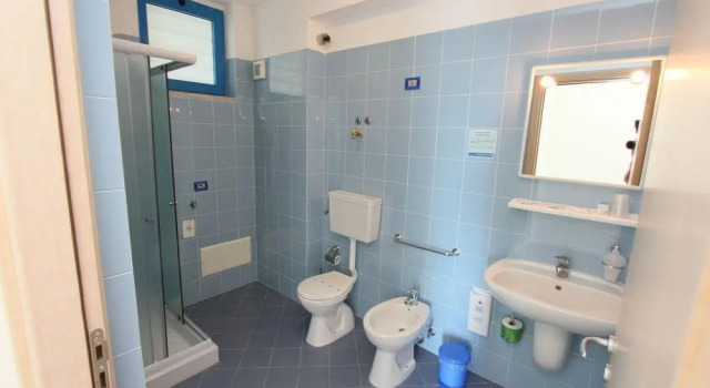 Кровать в общем номере Residence Miljunka