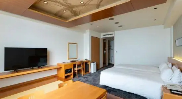 Кровать в общем номере Nara Plaza Hotel