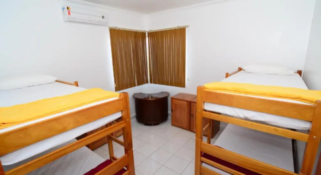 Кровать в общем номере Tanan Hostel