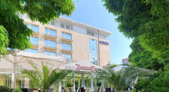 Кровать в общем номере Mercure Hotel Dortmund Centrum