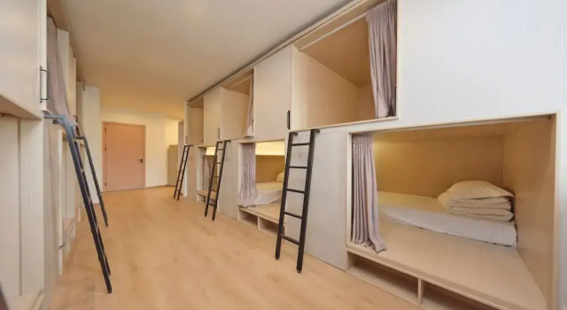Кровать в общем номере Timeless Recreation Hotel