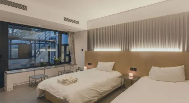 Кровать в общем номере Xiaoxi Hostel