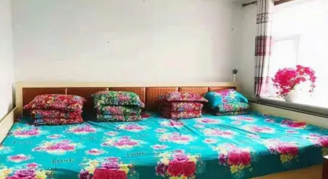 Кровать в общем номере Laocunzhang Farmhouse