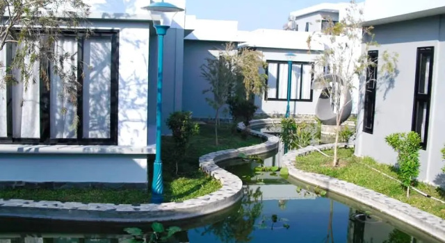Кровать в общем номере с видом на бассейн Vạn Nguyên Minihouse Mũi Né Resort - by Bay Luxury